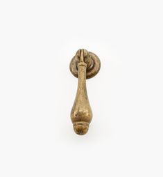 an old brass door handle on a white background