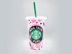 a pink starbucks cup with a green straw in it's sleeve and the words nail tech fuel printed on it