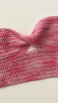 a pink and white knitted bow tie