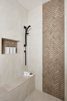 a bathroom with a shelf and towel rack on the wall