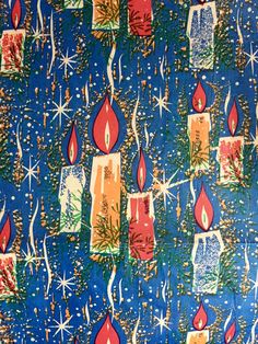 a blue background with lit candles and snowflakes on it's surface, as well as stars