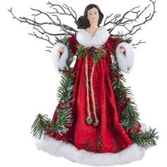 a christmas angel figurine is dressed in red and white