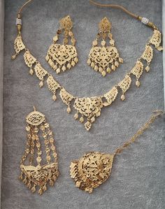 A stunning replica traditional high quality gold jewellery set including a necklace jhumar/passa tikka and chandalier earrings  A stunning Gold style set with perfection to detail looks just like real stuff will compliment and outfit and will stand out from far this set will also make a good addition to your collections but a excellent gift too  Picture do not do full justice Luxury Gold Bridal Necklace For Eid, Luxury Motif Jewelry For Puja, Old Style Punjabi Gold Jewellery, Luxury Hand Set Temple Jewelry Sets, Punjabi Gold Jewellery Set Traditional, Luxury 22k Gold Hand Set Necklace, Punjabi Jewellery Gold Jewelry Sets, Cheap Traditional Gold Tikka, Luxury Jeweled Temple Necklace For Diwali