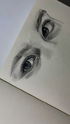 two drawings of an eye are shown in this drawing class photo provided by the artist