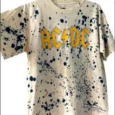 Ac/Dc Band Graphic Print Blue Paint Splatter All Over Print T-Shirt New Tags Ink Splatter - (Done By Manufacturer) Measurements: Taken On Flat Lay Across Pit2pit: 21” Length: 25” 100% Cotton Rt-2 Casual Relaxed Fit Paint Splatter T-shirt, Spring Cotton T-shirt With Paint Splatter, Relaxed Fit Cotton Top With Paint Splatter, Graphic Cotton T-shirt With Paint Splatter, Streetwear Cotton Tops With Paint Splatter, Cotton Graphic Tee With Paint Splatter, Paint Splatter Graphic Tee In Cotton, Paint Splattered Cotton Crew Neck Tops, Relaxed Fit Cotton T-shirt With Paint Splatter