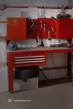 a red workbench with lots of tools on it