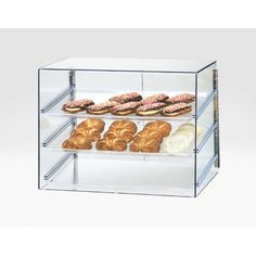 a display case filled with lots of different types of donuts and croissants