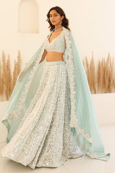 Blue can can attached lehenga featuring sequin and bead embroidered floral blossom motifs and pearl detailing. Comes with padded embroidered blouse and scalloped border dupatta. - Aza Fashions Blue Wedding Lehenga, Aqua Blue Lehenga, Pretty Lehengas, Sequinned Lehenga, Floral Bridal Lehenga, Studio Iris, Sangeet Lehenga, Lehenga For Wedding, Ethereal Elegance