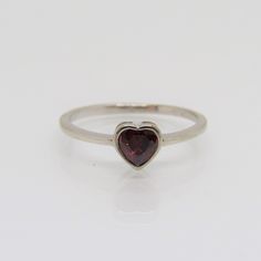 Sterling Silver Garnet Heart Ring....Marked 925...Total of weights 1.2grams... Size 7...Measure of Face 6MM...It's in very good condition. Sterling Silver Heart-shaped Ruby Ring In White Gold, Heart-shaped Ruby Ring In White Gold, Classic Sterling Silver Heart Ring With Gemstone, Stackable Heart Cut Sterling Silver Ring, Garnet Ring Vintage, Vintage Silver Ring, Garnet Heart, Metalsmithing Jewelry, Indie Jewelry