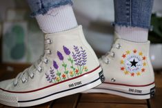 Custom embroidery converse high tops/Lavender embroidered sneakers/Converse 1970s embroidered lavender garden/Personalized bridal sneakers  🪡🪡"Experience the art of hand embroidery on Converse embroidered shoes, a testament to meticulous craftsmanship."  💸 Price includes Converse Shoes and floral embroidery as shown 🌸 You can send me your Converse/Vans shoes or I can buy them for you. We stock all the Converse and Vans shoes you want, if you want other Converse/Vans shoes in the store, please message us. Your embroidered Converse/Vans shoes will be available for shipping in 7-15 days. 🌸 I started hand embroidering on fashionable clothes and handbags over 20 years ago - and now on CONVERSE/VANS shoes, an American icon, a must-see classic! I'm excited to give your Chuck Taylor shoes a n Embroidery Converse, Converse Chuck 70s, Converse Fits, Embroidered Lavender, Converse 1970s, Embroidered Sneakers, Chuck Taylor Shoes, Bridal Sneakers, Embroidered Converse