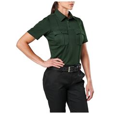 Stay cool and comfortable on the job. These 100% polyester moisture-wicking, anti-odor polos come in a variety of sizes and colors to best accompany your uniform or outfit. Spacious pockets feature pen storage and scalloped pocket flaps with button closures. Accessorize your shirt with included epaulettes, camera loop, and embroidered eyelets for badge attachment. | 5.11 Tactical Women's Class A Uniform Short Sleeve Polo Shirt In Le Green | Size Small | Polyester Fitted Short Sleeve Polo Shirt With Pockets, Fitted Collared Polo Shirt With Pockets, Functional Fitted Tops With Pockets, Fitted Tops With Pockets, Utility Fitted Tops For Workwear, Fitted Collared Utility Top, Tactical Shoes, Pen Storage, Tactical Pants