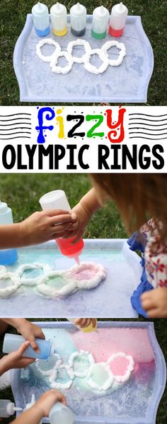 kids are making olympic rings out of play dough and plastic cups on a picnic table