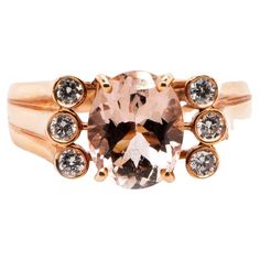 This is a unique and magnificent natural morganite and diamond ring set in solid 14K rose gold. The vivid 10X8MM 2.40 carat Morganite oval has an excellent peachy pink color (AAA quality gem) and is set on top of a gorgeous curved band that has 6 round cut diamonds surrounding the morganite gem. The ring is stamped 14K and is a true showstopper. ***** Details: ►Metal: Rose Gold ►Gold Purity 14K ►Natural Gemstone: Morganite (Part of the Beryl Family) ►Gemstone Weight: 2.40 carat ►Gemstone Color: Peachy Pink ►Gemstone Size/Shape: 10X8MM Oval ►Gemstone Origin: Mozambique ►Natural Diamonds: 0.27 carat ►Diamond Color & Clarity: G-H SI1-2 ►Total Item Weight: 5.2 grams ►Item No.: RMG544 ►Estimated Retail Value: $2800 Morganite Pendant, Rose Gold Diamond Ring Engagement, Engagement Rings Vintage Halo, Diamond Ring Set, Morganite Diamond, Diamond Ring Settings, Diamond Cocktail Rings, Morganite Ring, Rose Gold Engagement