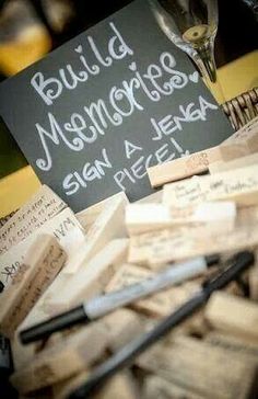 a pile of wine corks sitting on top of a table next to a sign