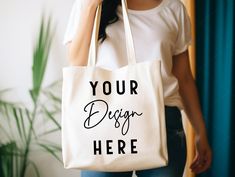 a woman carrying a tote bag that says your design here