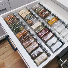 an open drawer with spices and seasonings in it