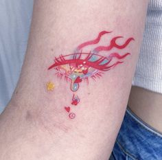 a close up of a person's arm with a tattoo on the left side