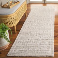 a white rug on the floor in front of a door