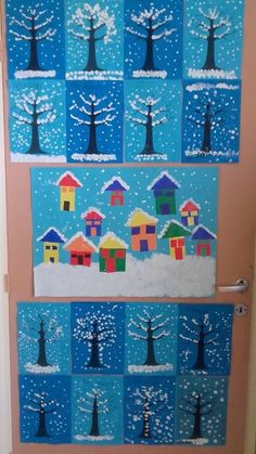 a door decorated with houses and trees