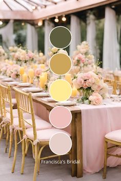 the table is set up with pink and yellow flowers, candles, and greenery