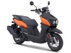 an orange and black scooter is shown on a white background