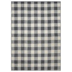 a black and white checkered rug on a white background