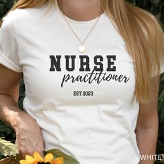 If you love the dedication, hard work and compassion of a Nurse Practitioner then this shirt is for you! This super soft, relaxed fit, short sleeve t-shirt is the perfect gift for your favorite nurse practitioner. NPs have the skills, knowledge and education to provide a wide range of nursing services to patients. This shirt will remind them of their dedication to hard work and education. This classic unisex jersey short sleeve tee fits like a well-loved favorite. Soft cotton and quality print m White Personalized Relaxed Fit T-shirt, White Relaxed Fit T-shirt For Nursing, White Relaxed Fit Nursing T-shirt, Nurse Practitioner Gifts, Family Nurse Practitioner, Nurse Appreciation Gifts, Nurse Practitioner, Nursing Graduation, Nurse Gifts