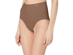 Calvin Klein Invisibles Modern Brief Panty - Women's Underwear : Toasted Taupe : 73% Nylon, 27% Elastane Sri Lanka Machine Wash Seamless elastic waistband and slips-on High rise brief silhouette and solid design Smooth, flexible microfiber and clean cut edges, invisible under clothing Logo at waist, full gusset and rear coverage Wear with a ck invisibles full slip If you're not fully satisfied with your purchase, you are welcome to return any unworn and unwashed items with tags intact and origin Compressive Briefs With Contoured Waistband, Fitted Seamless Brief Slip, Calvin Klein Seamless Cotton Bottoms, Calvin Klein Slip, Micro-elastic Briefs With Contoured Waistband, Seamless 4-way Stretch Swimwear Brief, Calvin Klein Woman, Clothing Logo, Clean Cut