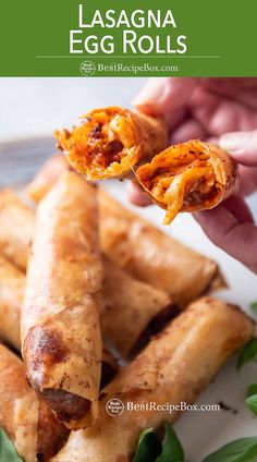 someone holding up some food to eat on a plate with the title lasagna egg rolls