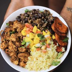 a white bowl filled with different types of food