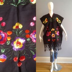 Gorgeous Ethnic Guatemalan Fringe Poncho Hand Made /  Hand Embroidered Rich Colourful Floral Motif With Fringe Detail Completely Open On Sides Excellent Vintage Condition One Size Fits Most Please Refer to Measurements to Ensure Best Fit With Poncho  Lying Flat, in inches: Width:  27 Total Length: 38 Traditional Shawl Kaftan For Festivals, Bohemian Embroidered Shawl Fabric, Bohemian Floral Embroidered Shawl For Festival, Festival Black Embroidered Poncho, Bohemian Shawl With Floral Embroidery For Festival, Bohemian Embroidered Festival Poncho, Bohemian Shawl With Embroidered Border For Festival, One Size Embroidered Folk Shawl, Embroidered Folk Shawl One Size