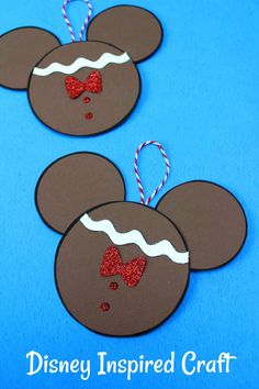 two mickey mouse ears with red glitter bow on them and the words disney inspired craft