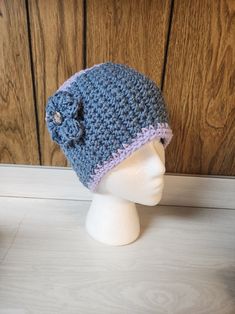 This handmade crocheted headband/ear warmers is the perfect addition to any casual outfit. The blue/purple color and flower theme make it a stylish accessory for anyone. Made of acrylic material and featuring a breathable design, it is comfortable to wear during the fall season. The headband also includes a button accent and solid pattern, adding to its unique and authentic handmade feel. This item is ready to ship and is perfect for those looking for a handmade accessory that is both stylish and functional. Purple Adjustable Crochet Hat, Adjustable Purple Crochet Yarn Hat, Adjustable Purple Yarn Crochet Hat, Adjustable Purple Hand Knitted Crochet Hat, Adjustable Purple Crochet Hat, Adjustable Hand Knitted Purple Crochet Hat, Adjustable Hand-knitted Purple Crochet Hat, Handmade Adjustable Purple Headband, Adjustable Handmade Purple Headband