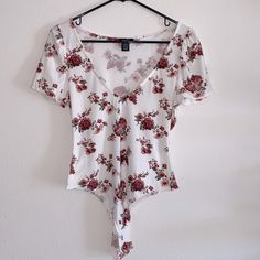 Deep V-Neck, Slight Puff Sleeve Never Worn, Perfect Condition! Casual Stretch Bodysuit With Floral Print, Casual Stretch Floral Print Bodysuit, Fitted V-neck Floral Print Bodysuit, Casual V-neck Bodysuit For Spring, Casual Pink Bodysuit With Floral Print, Pink V-neck Bodysuit For Spring, Pink V-neck Spring Bodysuit, Deep V Bodysuit, Tank Top Bodysuit