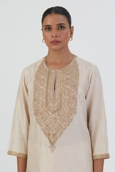 White silk kurta featuring thread embroidered floral motifs on bodice highlighted by sequin embellishments. Comes with scalloped hem pant. - Aza Fashions Elegant Semi-stitched Gold Embroidered Fabric, Elegant Gold Embroidered Fabric For Diwali, Anarkali Kurta With Gold Embroidery For Eid, Eid Anarkali Kurta With Gold Embroidery, Elegant Chikankari Embroidered Top For Wedding, Elegant Floral Embroidered Raw Silk Palazzo Set, Elegant Palazzo Set With Floral Embroidery For Eid, Elegant Floral Embroidered Palazzo Set For Eid, Elegant Floral Embroidery Palazzo Set For Eid