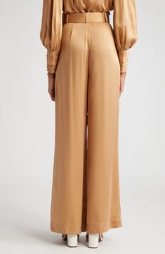 Bask in the glow of pure silk in these pleated high-waist pants cut with flowy wide legs and cinched with a buckled belt. 33" inseam; 30" leg opening; 14" front rise; 17" back rise (size 4US) Zip fly Front slant pockets Removable belt 100% silk Dry clean Imported Designer Clothing High-waisted Silk Wide Leg Pants For Evening, Silk High-waisted Wide Leg Pants For Evening, Silk High-waisted Wide Leg Evening Pants, Chic Silk Wide Leg Full Length Pants, Chic Full-length Silk Wide Leg Pants, Chic Silk Wide Leg Pants Full Length, Chic Full Length Silk Wide Leg Pants, Evening Wide Leg Bottoms With Pleated Waist, Silk High-waisted Wide Leg Pants For Party