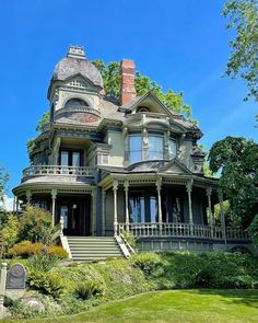 an old victorian style house with many windows and balconies