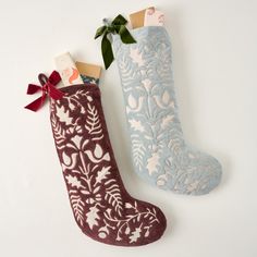 Hang these stockings, available in rich chestnut and serene blue hues, by the chimney with care. Crafted from soft cotton velvet and featuring a delicate cutwork pattern designed by our in-house team, each stocking comes with a charming velvet bow, adding a distinctive touch to complete the look.