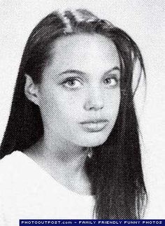 an old photo of a young woman with long hair and wearing a t - shirt