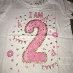 Nwt I Am 2 Years Old Birthday Shirt Sz 3t 3 Brand New With Tags From Tcp The Childrens Place Size 3t 3 Shirt Top Short Sleeves For The Birthday Girl Who Is Turning 2 Years Old Great Present For Her To Wear To Her Birthday Party Or Wear All Year Long To Remember Just Exactly How Old She Is Has The Number 2 Large On It With A Party Hat And Lots Of Confetti Reads I Am And Then The Year Old Number Glitter Gold Design Along With The Pink 2nd Birthday Have Mutiples Available Sisters Twins Triplets Pink Crew Neck Top For First Birthday, Pink Number Print T-shirt For Birthday, Pink Short Sleeve T-shirt With Number Print, Pink Tops With Letter Print For First Birthday, Playful Pink Tops For First Birthday, Playful Pink Top For First Birthday, Pink Top For First Birthday In Spring, Pink Tops For First Birthday In Spring, Pink Graphic Print Top For Birthday