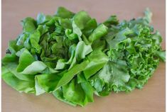 some lettuce is laying on the table