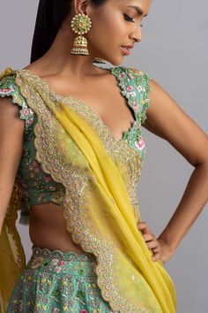 Sea-green organza lehenga with thread work, multi-color floral motifs and scallop hem. Comes with embellished blouse and yellow dupatta.
Components:3
Embroidered
Neckline:V Neck
Sleeve Length:Cap
Fabric:Organza
Color:Green
Plunging neck
Tie-up cutout back
Cutwork detail
Note: Cancan worn by the model is not for sale - Aza Fashions Green Chanderi Lehenga With Unstitched Blouse, Green Pre-draped Saree With Intricate Embroidery For Festivals, Green Chanderi Pre-draped Saree With Intricate Embroidery, Green Pre-draped Saree With Intricate Embroidery For Wedding, Green Pre-draped Saree With Intricate Embroidery For Reception, Green Organza Choli With Intricate Embroidery, Designer Green Organza Lehenga, Green Tissue Silk Choli With Intricate Embroidery, Designer Organza Lehenga In Green