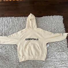 Size Small, Never Used, Brand New Tan Essentials Hoodie Outfit, Cream Athleisure Sweatshirt For Streetwear, Spring Beige Sweatshirt For Streetwear, Beige Sweatshirt For Spring Streetwear, Essential Fall Hoodie Sweatshirt, Essential Long Sleeve Winter Sweatshirt, Cozy Cream Sweater For Streetwear, Winter Long Sleeve Sweatshirt, Cream Long Sleeve Hoodie For Athleisure