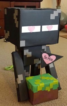 a minecraft creeper with a heart on it's chest sitting next to a box