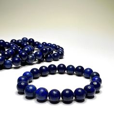 Lapis Lazuli Crystal Bracelet, 10mm Lapis Lazuli Gemstone Beaded Bracelet You will receive 1 (ONE) Lapis Lazuli 10mm Beaded Bracelet like the item pictured.  Great for mixing and matching with other regular bracelets. Lapis Lazuli is a deep blue gemstone that is believed to have powerful metaphysical properties. It is thought to be a stone of wisdom, truth, and inner vision. Lapis Lazuli is said to enhance intellectual ability, promote spiritual growth, and encourage self-awareness. It is also b Polished Beads Lapis Lazuli Bracelets, Polished Beads Lapis Lazuli Round Bracelets, Lapis Lazuli Beaded Bracelets With Polished Round Beads, Round Lapis Lazuli Bracelets With Polished Beads, Lapis Lazuli Crystal, Lapis Lazuli Gemstone, Hippie Bracelets, Gemstone Beaded Bracelets, Tie Styles