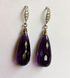 "Luxury Purple Amethyst sterling Silver Pave Earrings. Statement jewelry. Ultra violet stone dangles. February birthday. Artisan, Purple Amethyst Stone silver pave earrings. Vintage inspired, Pave sterling silver French earwires studded with tiny CZ in front that look like Diamonds. Elegant, sophisticated, and classy! These two lavish, faceted, AAAA+ quality, dark purple Amethyst briolettes are gems with vibrant purple hues, both stones are approximately 31 carats, each 22 x 10mm, the earrings a Formal Briolette Earrings With Gemstone Accents, Purple Sterling Silver Teardrop Dangle Earrings, Purple Amethyst Drop Teardrop Earrings, Purple Amethyst Teardrop Earrings, Long Drop Gemstone Earrings For Formal Occasions, Elegant Purple Briolette Earrings, Purple Gemstone Teardrop Earrings, Elegant Purple Teardrop Gemstone, Purple Sterling Silver Teardrop Earrings