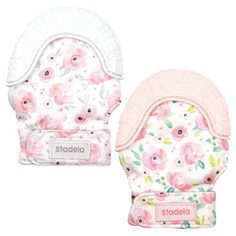 two baby bibs with flowers on them, one is pink and the other is white