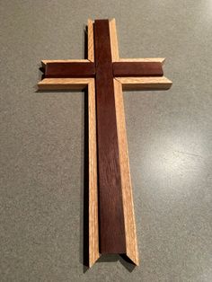 a wooden cross sitting on top of a table