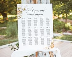 a seating chart is set up on an easel for guests to sit down at