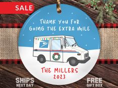 a christmas ornament that says thank you for going the extra mile with an ambulance